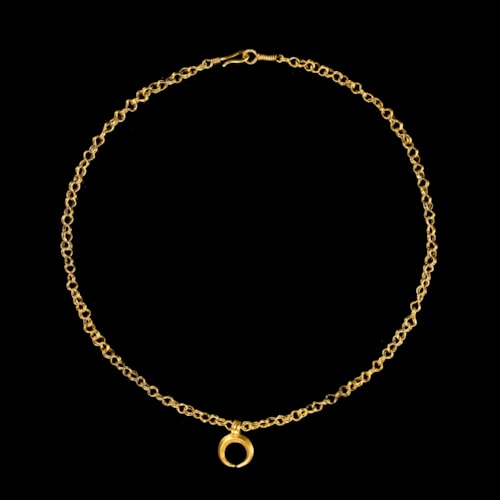 A Roman gold necklace with crescent-shaped pendant.